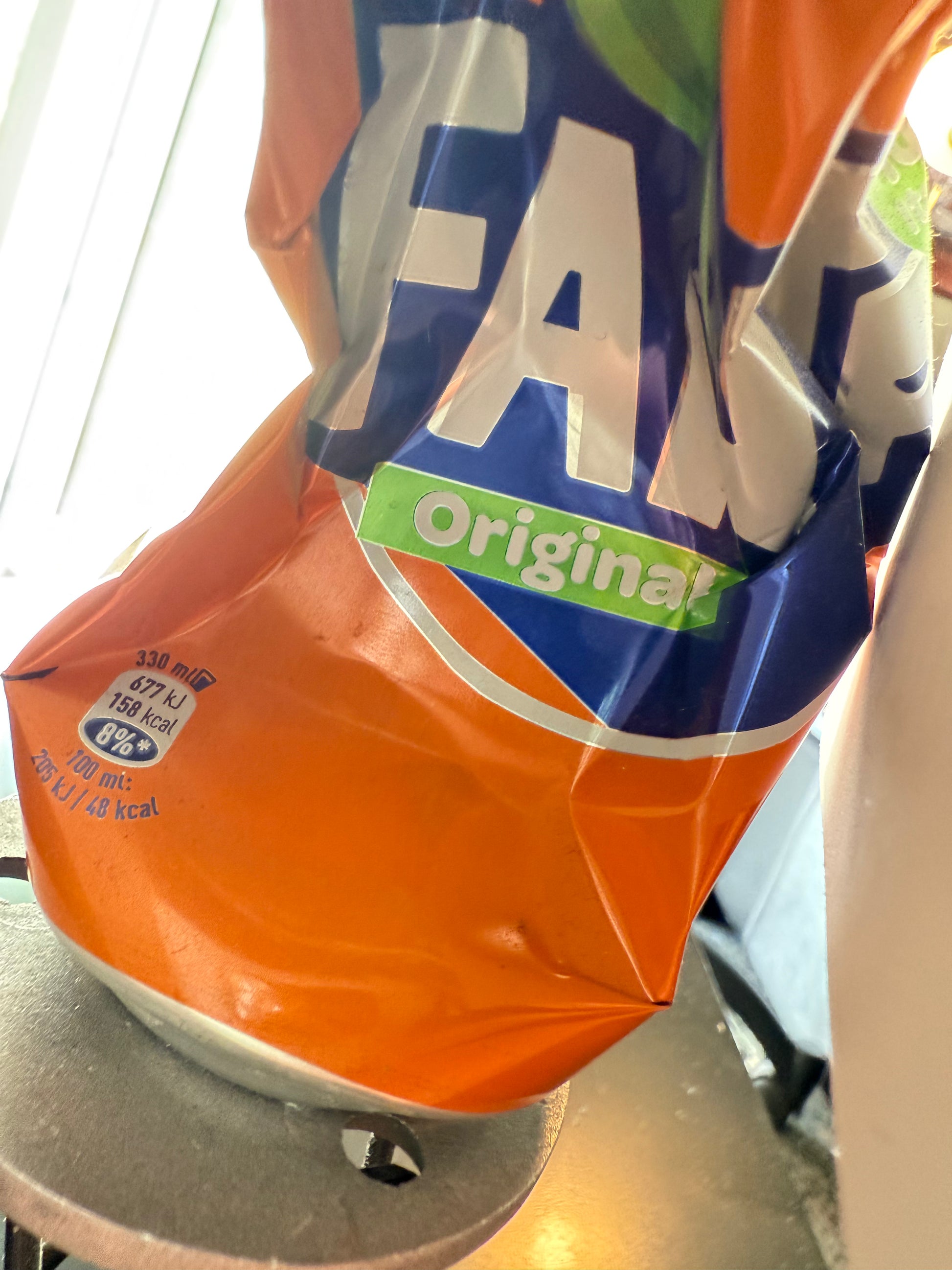 detail of conceptual art installation 30cm height – crushed Fanta can with protest sign mixed media piece – Maison Mattia